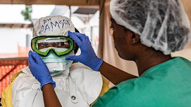 First person gets new experimental vaccine for Ebola